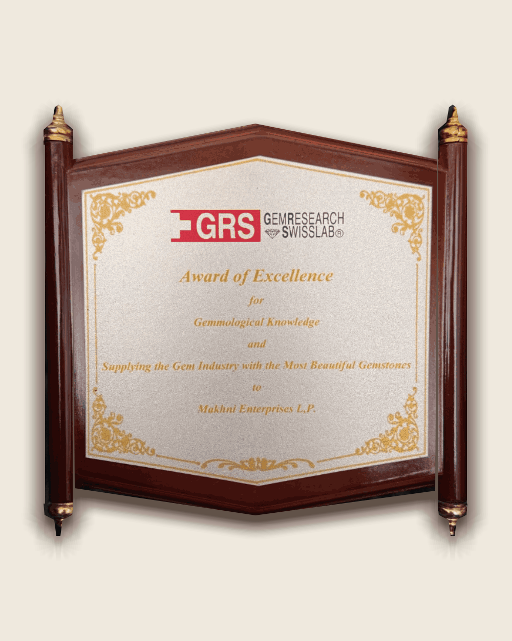 GRS GemResearch Swisslab Award of Excellence plaque presented to Makhni Enterprises