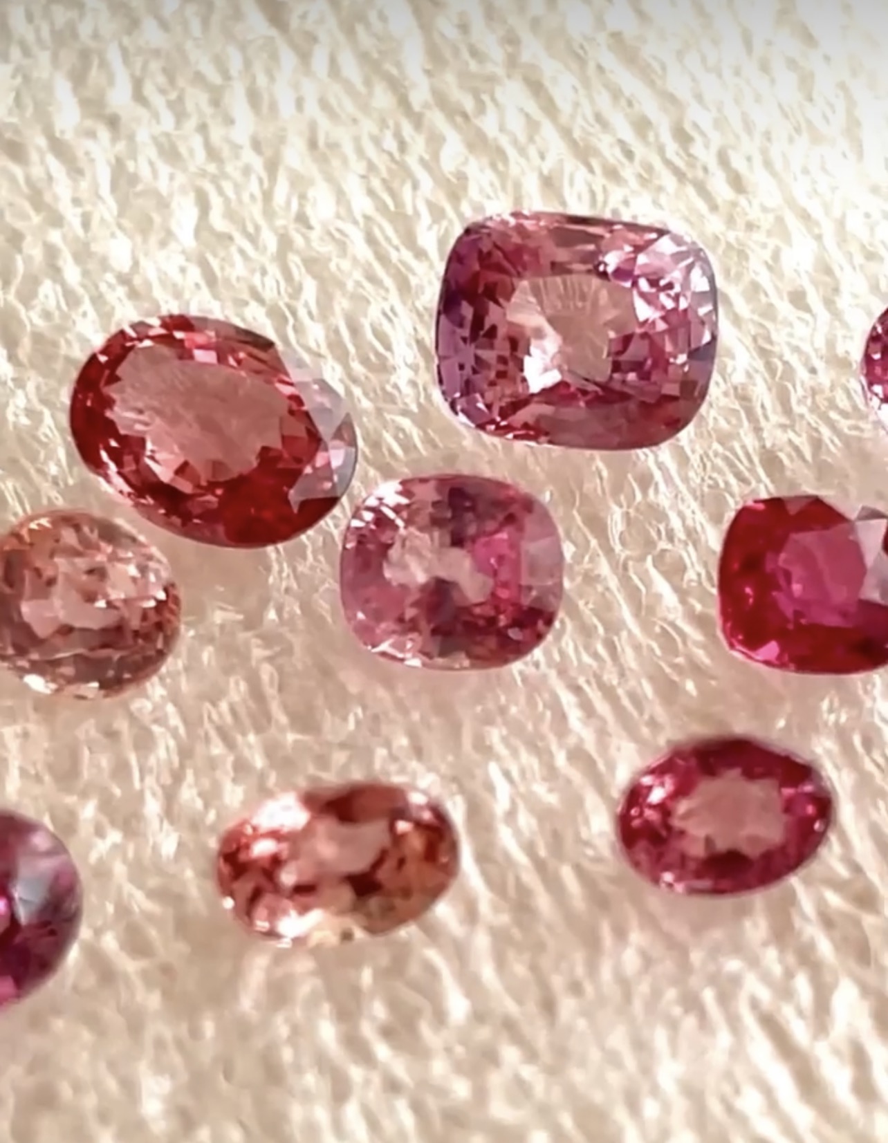 A collection of padparadscha and pink-orange sapphires